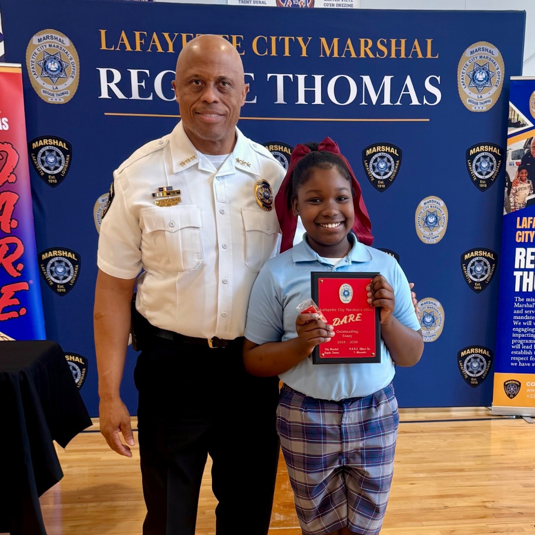 Marshal congratulates a D.A.R.E. graduate