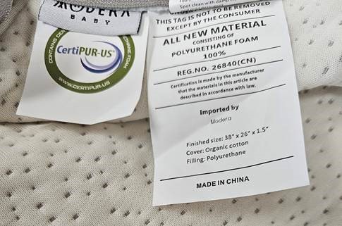 Mattress tags - ALL NEW MATERIAL CONSISTING OF POLYURETHANE FOAM 100% REG.NO. 26840(CN) Certification is made by the manufacturer that the materials in this article are described in accordance with the law. Imported by Modero Finished size: 38" x 26" x 1.5" Cover: Organic cotton. Filling: Polyurethane. MADE IN CHINA